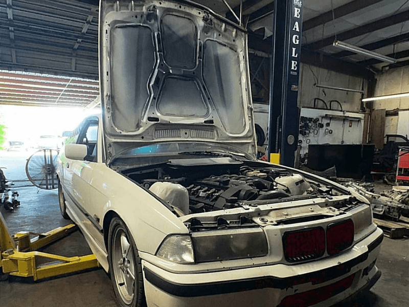 import car on a lift at Foreign Auto Center in Valdosta